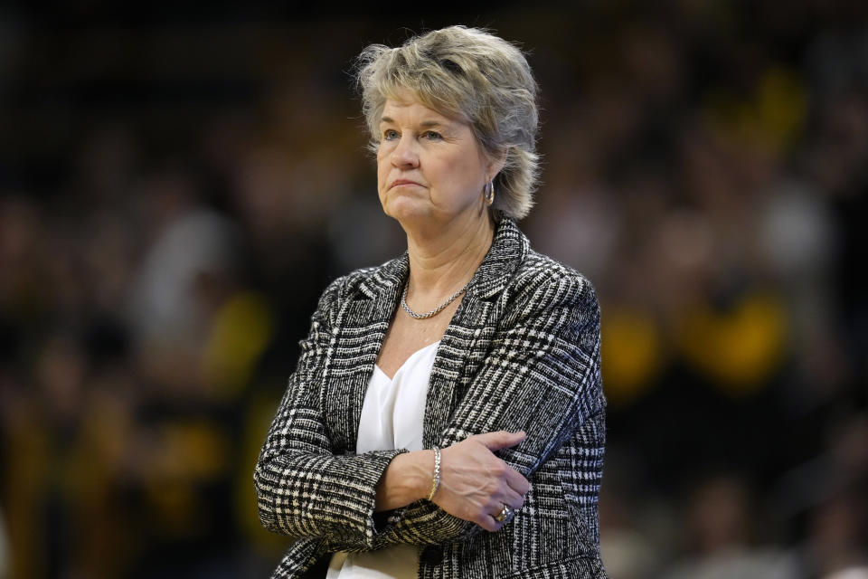 Iowa head coach Lisa Bluder watches from the bench during the first half of an NCAA college basketball game against Nebraska, Saturday, Jan. 27, 2024, in Iowa City, Iowa. (AP Photo/Charlie Neibergall)