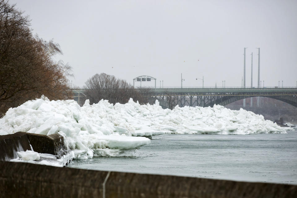 A massive build up of ice is seen after being pushed onto the shore of Mather Park, near the Peace Bridge in Fort Erie, Ont., Monday, Feb. 25, 2019. A windstorm Sunday broke an ice boom in Lake Erie and allowed the ice, which was floating on the water at the mouth of the Niagara River, to spill over the retaining wall and onto the shore and the roadway above. (Tara Walton/The Canadian Press via AP)