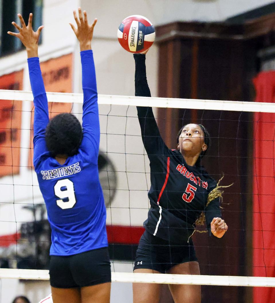 Brockton's Kesmyn Alves spikes the volleyball during a game versus Quincy on Wednesday, Sept. 7, 2022. 