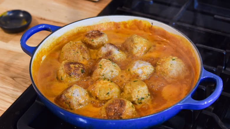 simmering turkey ginger meatballs in curry sauce