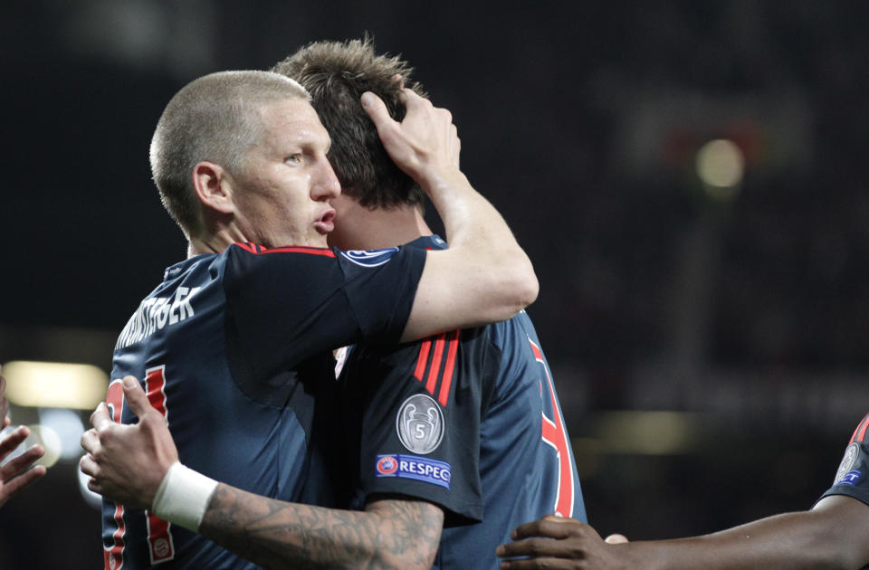 Bayern's Bastian Schweinsteiger celebrates scoring his side's first goal during the Champions League quarterfinal first leg soccer match between Manchester United and Bayern Munich at Old Trafford Stadium, Manchester, England, Tuesday, April 1, 2014.(AP Photo/Jon Super)