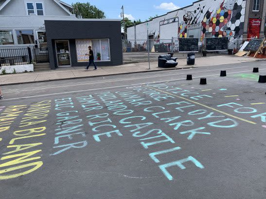 The names of Black people who died in police custody line the street at the intersection where George Floyd was murdered in Minneapolis. (Beth Hawkins)