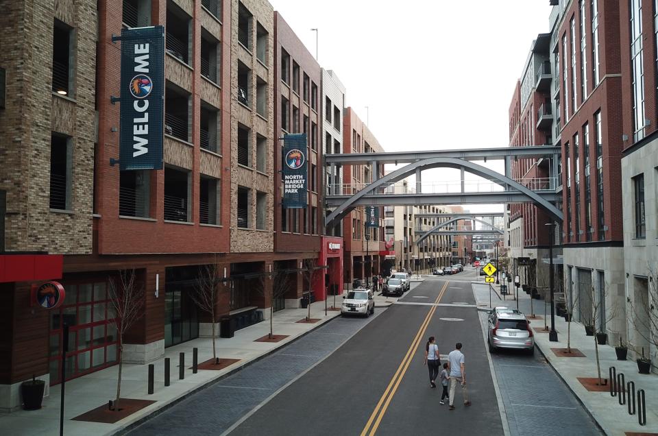 On land that was once a strip shopping center and a golf driving range, Dublin's Bridge Park development features a dense mix of shopping, restaurants, offices and housing. 