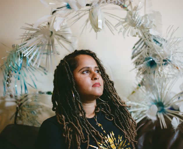 Cee Bolakee is pictured in her home studio, where she makes all of her intricate and detailed Carnival costumes. Her theme this year is inspired by the effects of climate change on coral reefs around the world, particularly her home island of Mauritius. The costumes are named after notable coral reefs to advocate for environmental sustainability, and are made of recycled materials such as plastic bottles and paper plates. “I get to express myself and see people enjoying themselves, and I have a part to play in that,” Bolakee says. (Photo: Clara Watt for HuffPost)