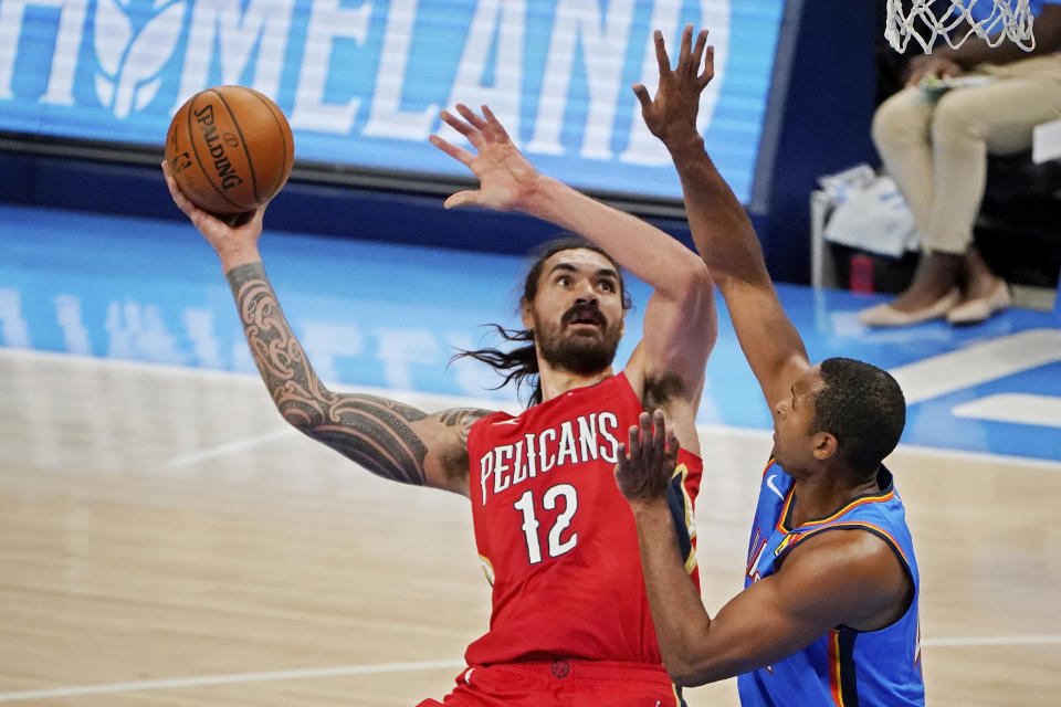 New Orleans Pelicans center Steven Adams shoots in front of Oklahoma City Thunder center Al Horford, right, during the second half of an NBA basketball game Thursday, Dec. 31, 2020, in Oklahoma City. (AP Photo/Sue Ogrocki)