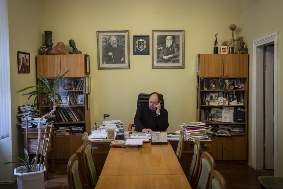 Ihor Kozhan, Andrey Sheptytsky National Museum general director works in his office in Lviv, western Ukraine, Friday, March 4, 2022. The doors of the museum have been closed since Russia's war on Ukraine began on Feb. 24. "We didn’t believe it till the last minute that this could happen,” Kozhan said. (AP Photo/Bernat Armangue)