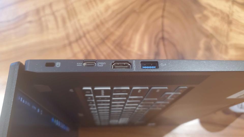 black chromebook on wooden desk