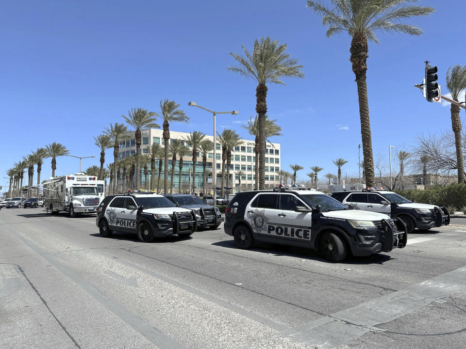 Law enforcement responds to a shooting Monday, April 8, 2024 at a law office in Las Vegas. (AP Photo/Ty ONeil)