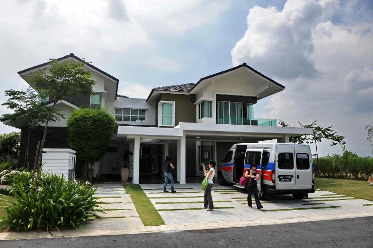 This file photo shows visitor looking around a luxury home at Iskandar Malaysia district in southern state of Johor Bahru, on May 13, 2010