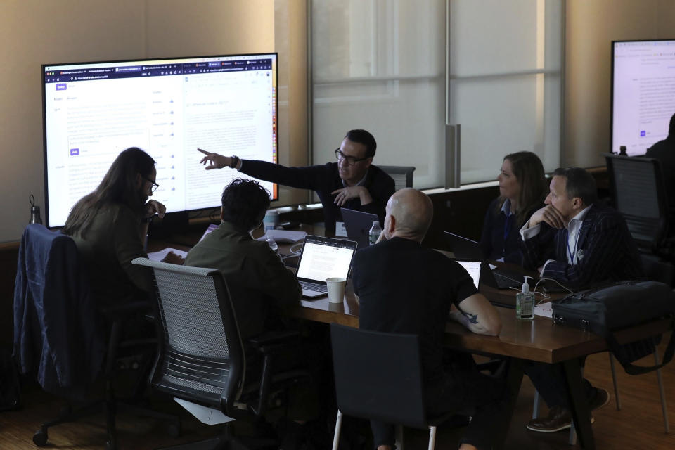 RETRANSMITTING TO REMOVE REFERENCE TO MIRANDA BOGEN This photo provided by Lauren Feeney shows a group of election officials and AI experts from civil society, academia, industry and journalism testing how different AI models respond to queries voters might ask about elections, at Columbia University in New York, Jan. 25, 2024. (Lauren Feeney/Proof News via AP)