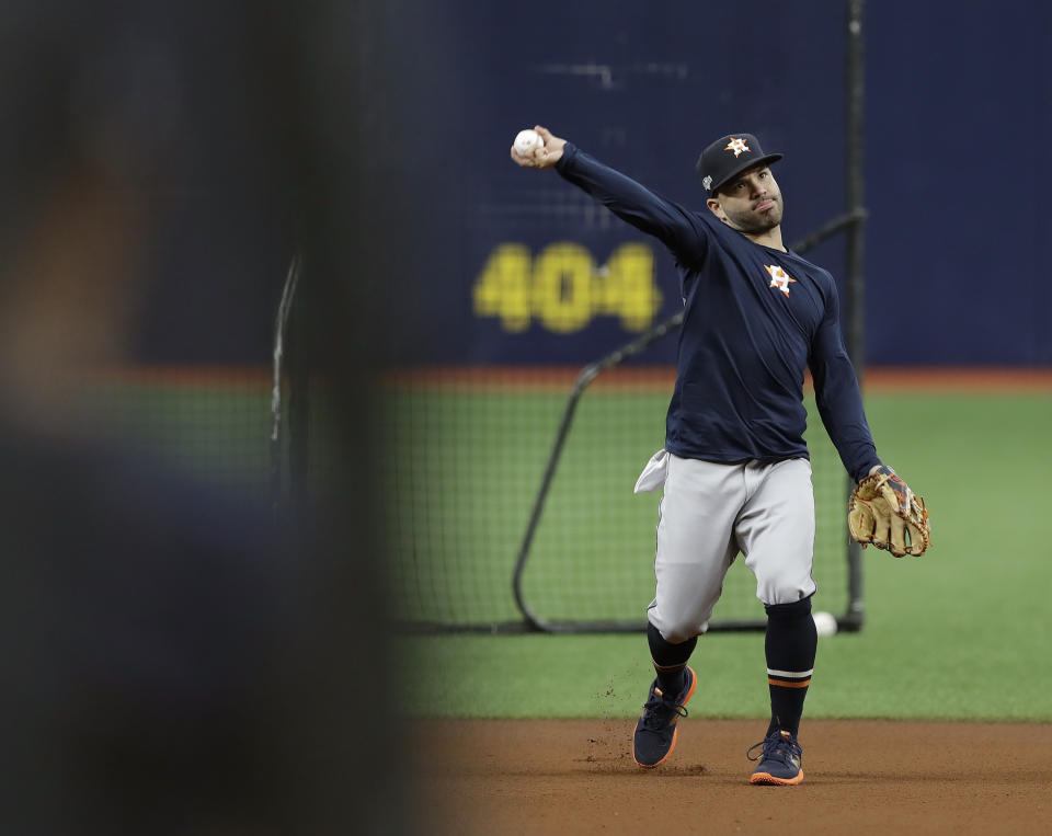 Houston Astros second baseman Jose Altuve throws the ball during practice Sunday, Oct. 6, 2019, in St. Petersburg, Fla. The Astros take on the Tampa Bay Rays in Game 3 of a baseball American League Division Series on Monday. (AP Photo/Chris O'Meara)