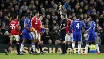 Football Soccer - Chelsea v Manchester United - Barclays Premier League - Stamford Bridge - 7/2/16 Manchester Unted's Chris Smalling is shown a yellow card by referee Michael Oliver Reuters / Stefan Wermuth Livepic