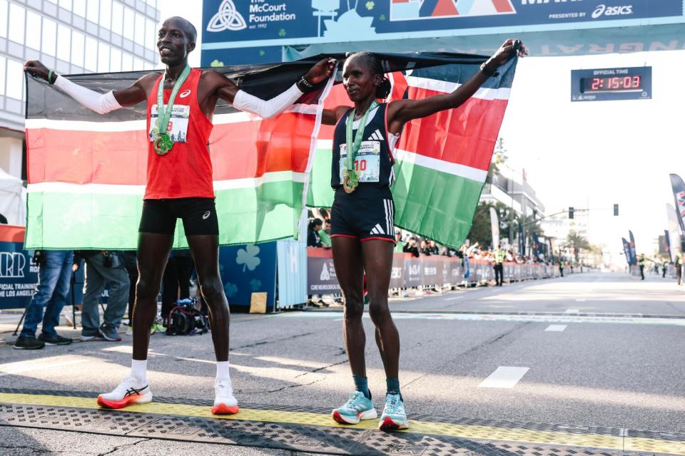 Dominic Ngeno and Stacy Ndiwa, the first male finisher and the first female finisher celebrate their wins