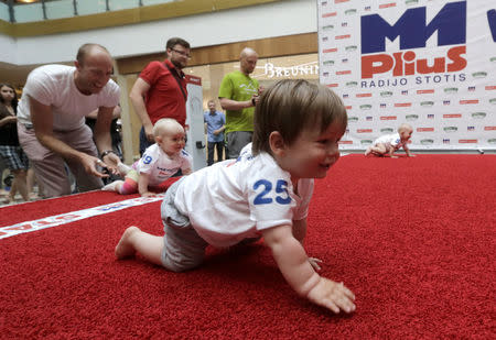 Babies crawl during the Baby Race to mark international Children's Day in Vilnius, Lithuania, June 1, 2016. REUTERS/Ints Kalnins