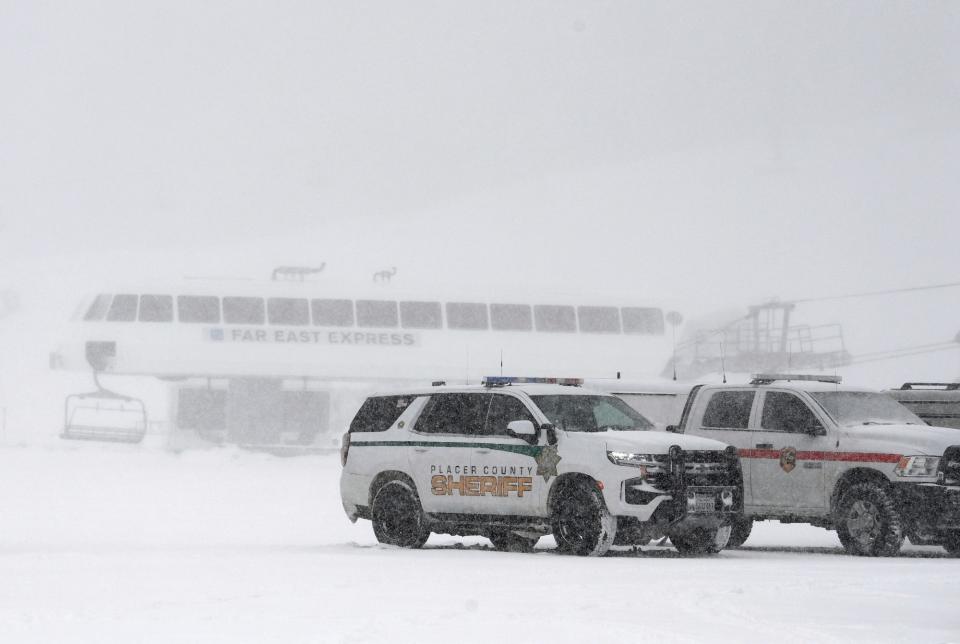 Placer County sheriff's vehicles are parked near the ski lift at Palisades Tahoe where an avalanche occurred on Wednesday, Jan. 10, 2024, in Tahoe, Calif.
