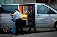 A men works beside the casket after a 21-year-old Syrian refugee killed a woman with a machete and injured two other people in the city of Reutlingen, Germany July 24, 2016. REUTERS/Vincent Kessler