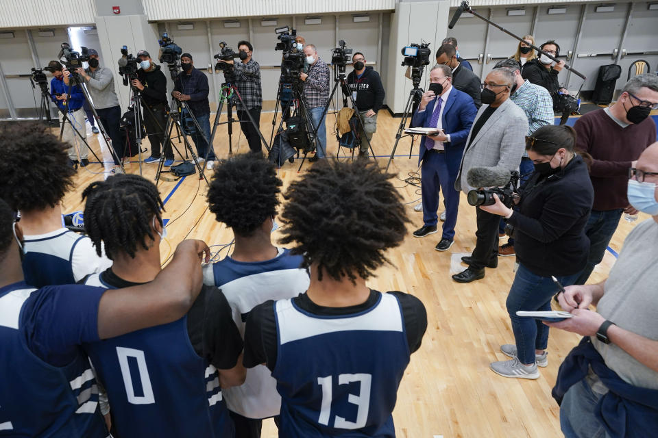 The St. Peter's University men's basketball team talks to reporters before NCAA college basketball practice in Jersey City, N.J., Tuesday, March 22, 2022. (AP Photo/Seth Wenig)