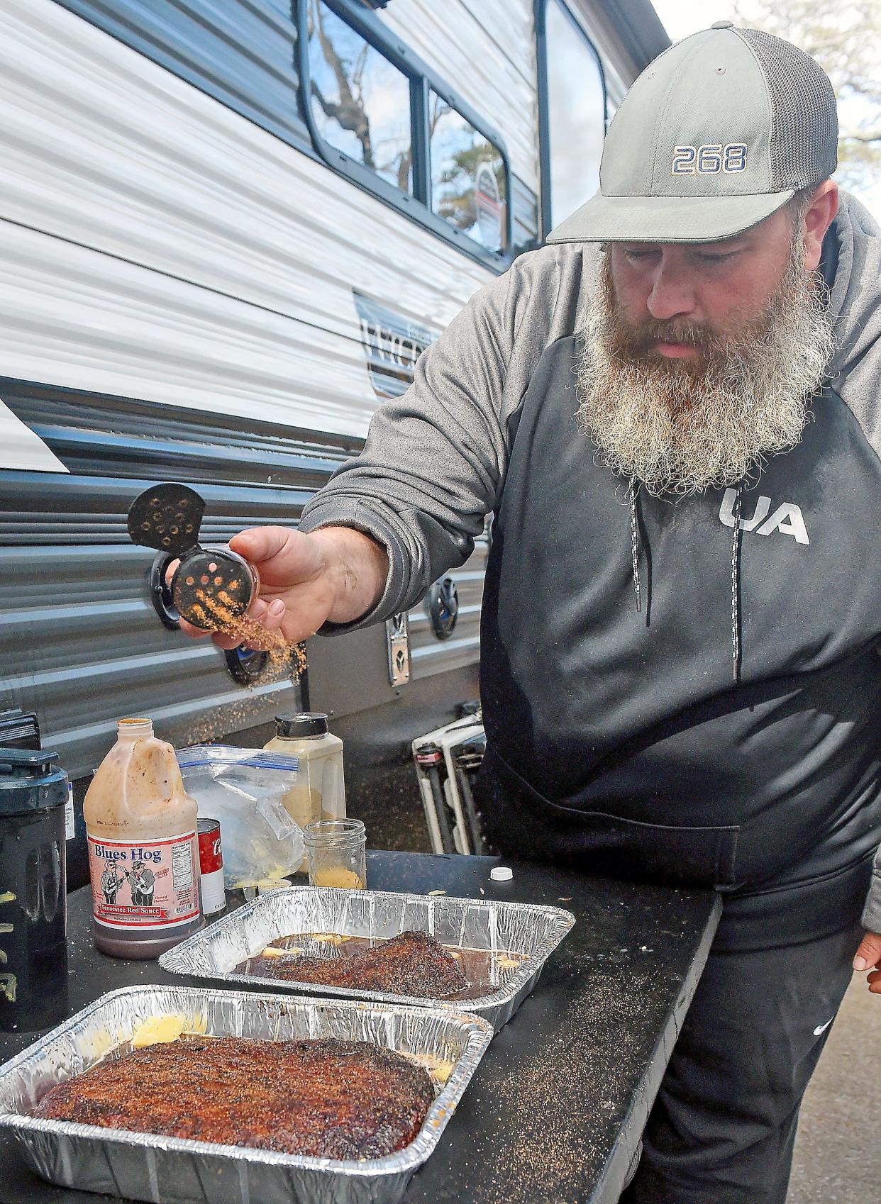 Danny Vohs seasons and wraps competition brisket Nov. 13, 2022, during the Kansas City Barbeque Society World Invitational Championship at Noccalula Falls Park in Gadsden. Vohs is part of the Coming in Hot BBQ team from St. Louis.