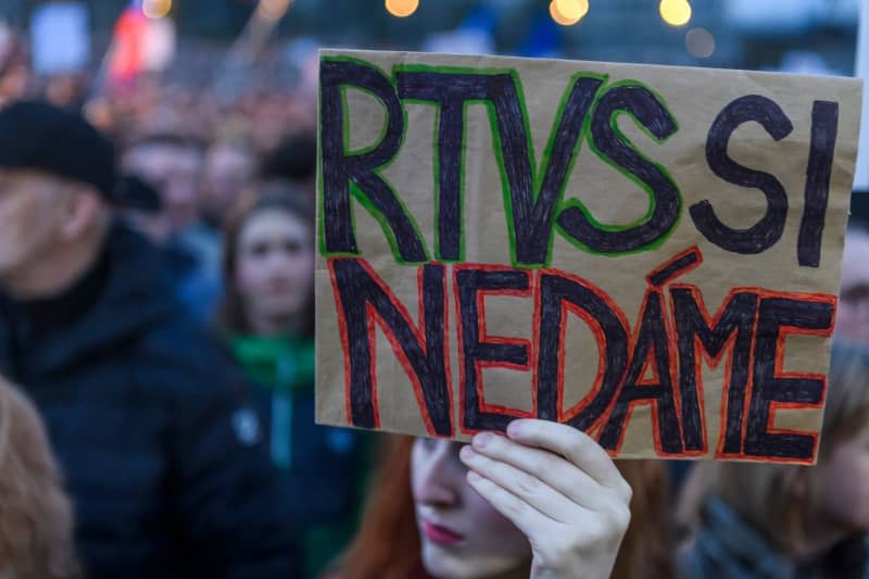 A demonstrator holds a sign during a protest organized by the opposition movement Progressive Slovakia (PS) and the Freedom and Solidarity Party (SaS) on Freedom Square. The inscription reads: "We will not let RTVS be taken away from us". The Slovakian government led by left-wing populist Prime Minister Robert Fico has approved the dissolution of the public broadcaster RTVS. Jaroslav Novák/TASR/dpa