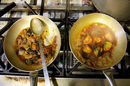 Vegan meals are cooked in the kitchen of the City Spice curry house restaurant on Brick Lane in London, Britain January 7, 2019. Picture taken January 7, 2019. REUTERS/Simon Dawson