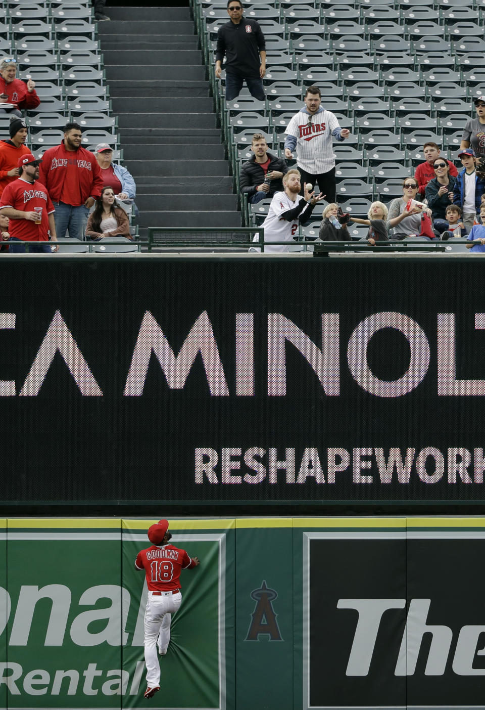 Los Angeles Angels center fielder Brian Goodwin, bottom, watches as a two-run home run by Minnesota Twins' Jorge Polanco goes over the wall during the second inning of a baseball game Thursday, May 23, 2019, in Anaheim, Calif. (AP Photo/Marcio Jose Sanchez)