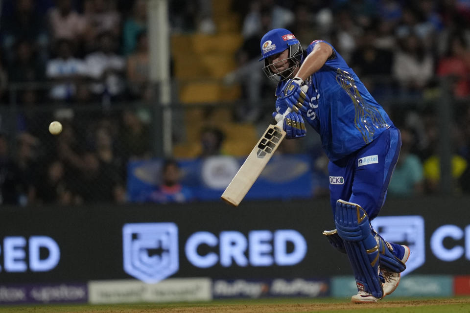 Mumbai Indian's Tim David plays a shot during the Indian Premier League cricket match between Mumbai Indians and Rajasthan Royals in Mumbai, India, Sunday, April 30, 2023. (AP Photo/Rajanish Kakade)