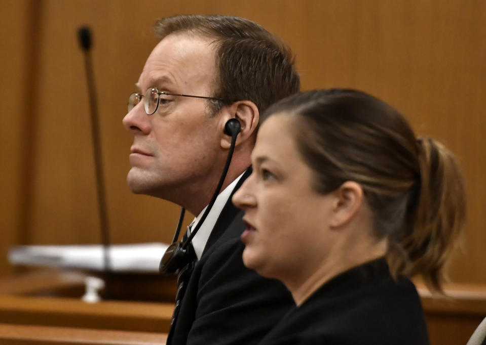 Mark Jensen, left, and his attorney Mackenzie Renner listen as the state gives its opening statement during Jensen's trial at the Kenosha County Courthouse on Wednesday, Jan. 11, 2023, in Kenosha, Wis. The Wisconsin Supreme Court ruled in 2021 that Jensen deserved a new trial in the 1998 death of his wife Julie Jensen, who was poisoned with antifreeze. (Sean Krajacic/The Kenosha News via AP, Pool)