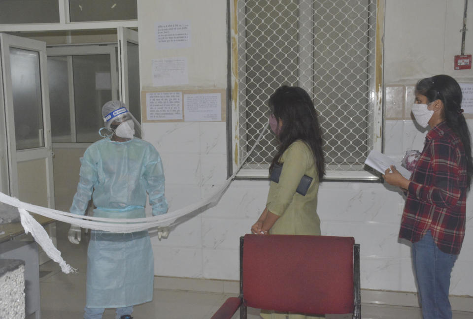 People queue to give swab sample for coronavirus test in Ghaziabad (Photo by Sakib Ali/Hindustan Times via Getty Images)