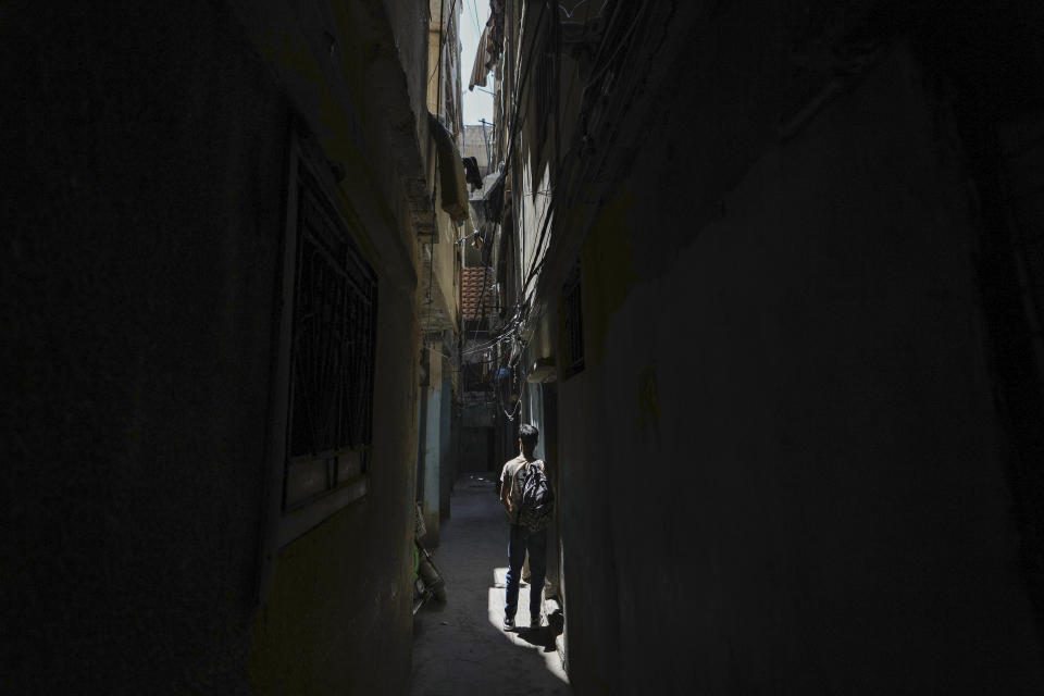 A Palestinian young man walks at the Palestinian refugee camp of Shatila in Beirut, Lebanon, Wednesday, May 15, 2024. The Nakba, Arabic for "catastrophe," refers to the 700,000 Palestinians who fled or were driven out of what today is Israel before and during the war surrounding its creation in 1948. (AP Photo/Hassan Ammar)