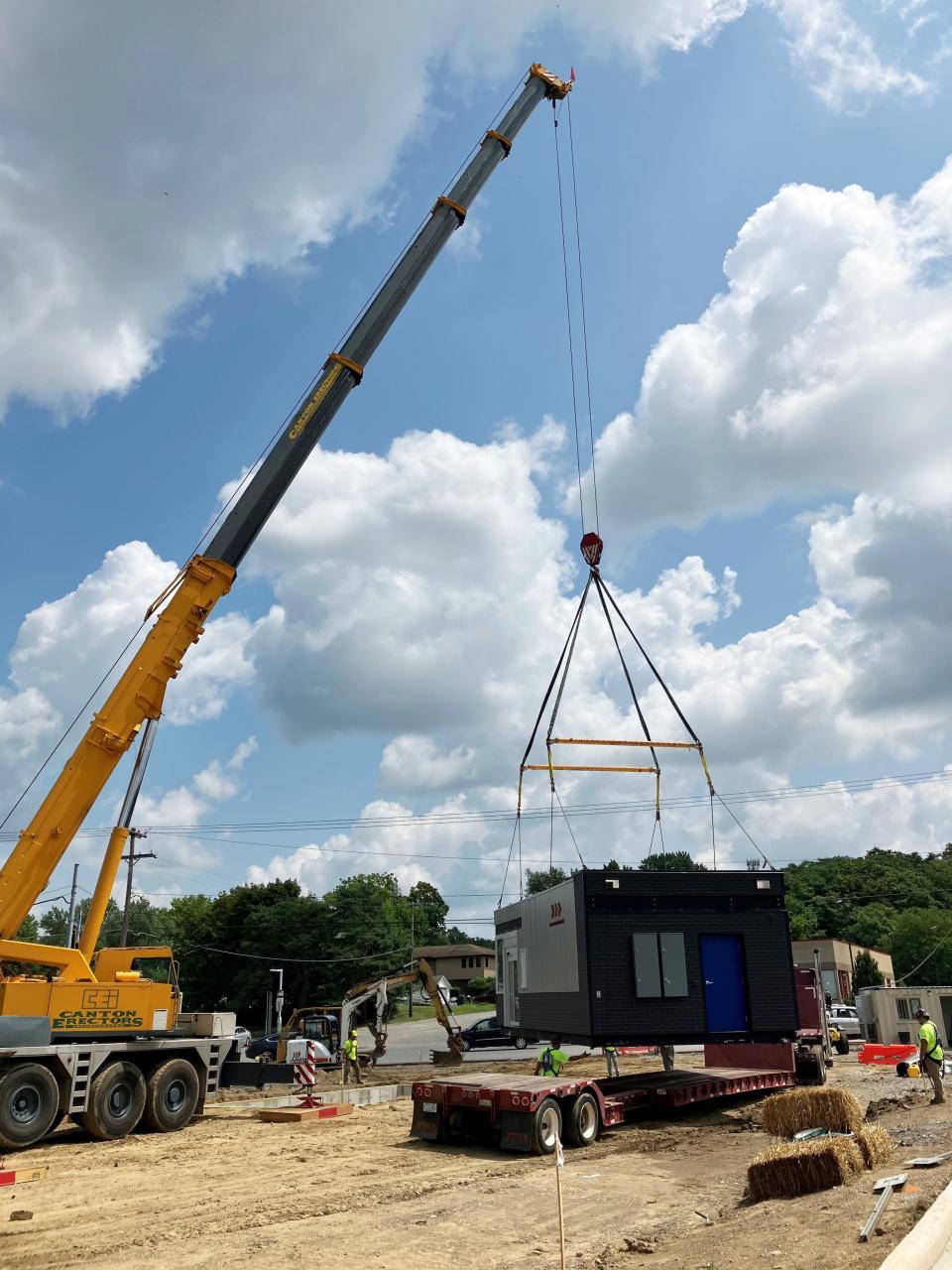 Workers with J.L. Moore Construction, of Strongsville, help drop the new 7 Brew structure on its foundation on Wednesday at 1361 Maple Avenue. The drive-thru coffee and beverage franchise, owned by Cleveland-area native Rick Nader, will open its doors in mid-September.