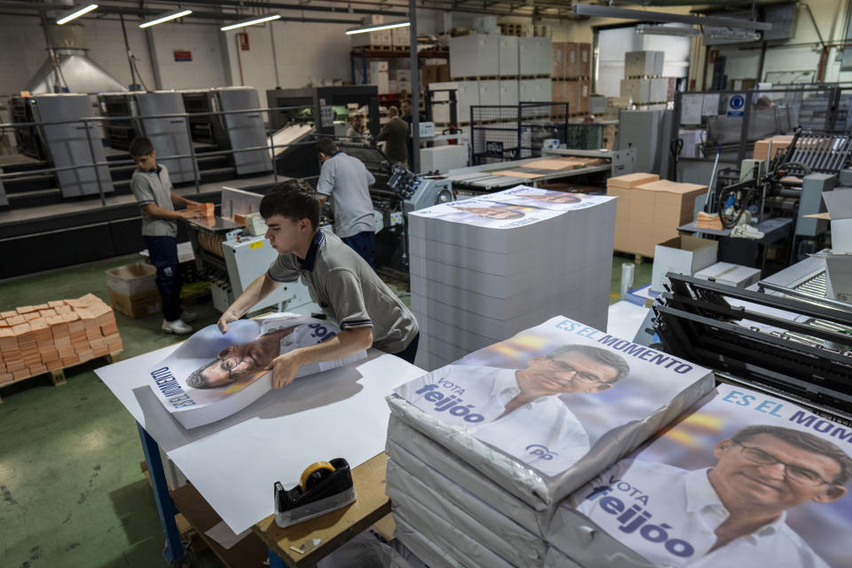 Election campaign posters of Popular Party candidate Nunez Feijoo are stacked at a print house in Madrid, Spain, Friday, June 30, 2023. The conservative Popular Party candidate for Sunday's general election is mostly unknown outside Spain, but he has been the country's most solid regional leader so far this century and has never lost an election. (AP Photo/Bernat Armangue)