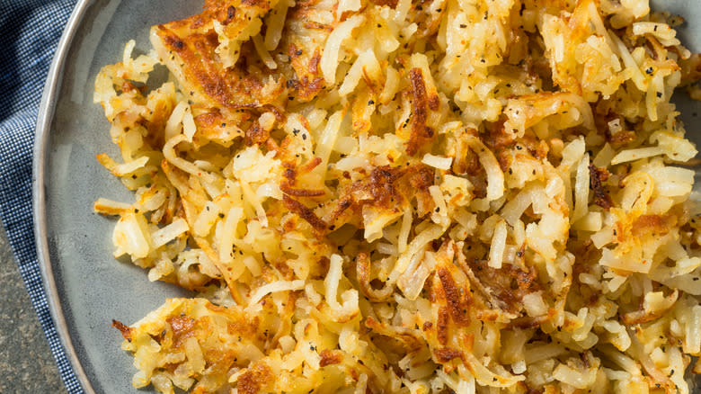 Close-up of hash browns on plate