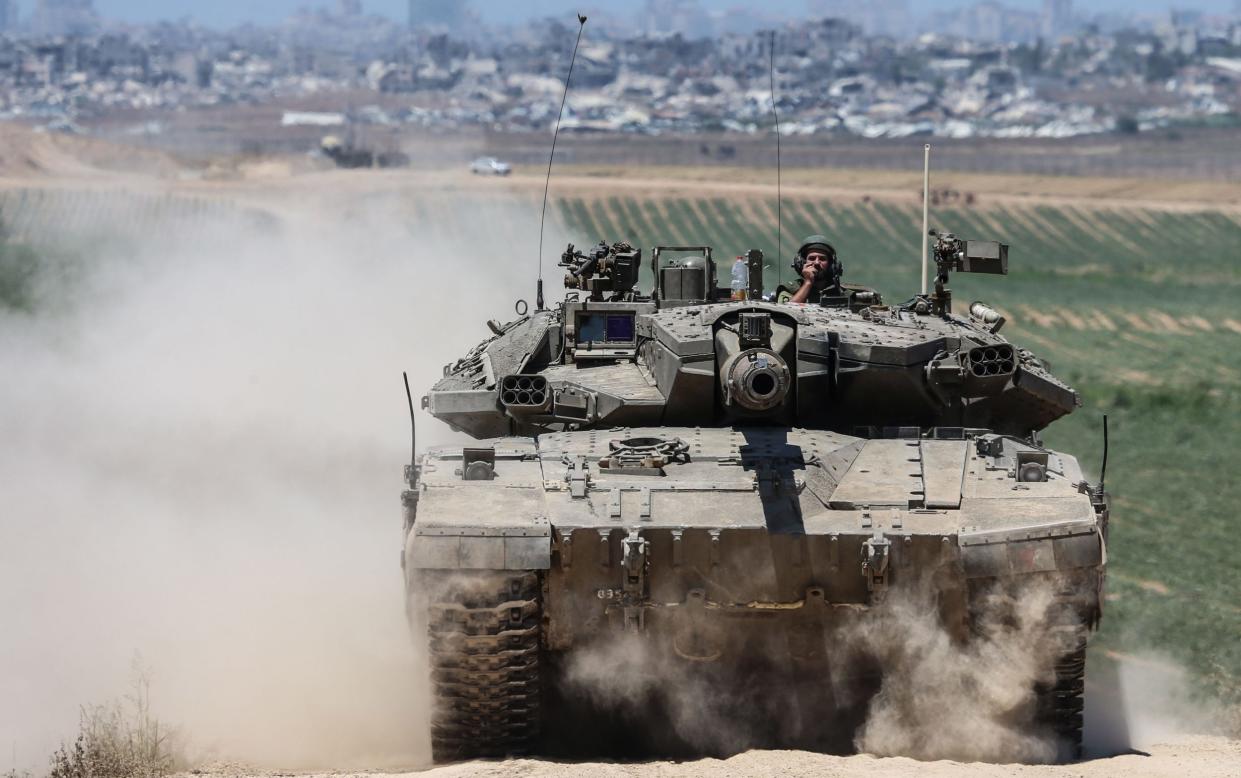 Israeli tanks advanced to edge of a crowded district in the centre of Rafah, witnesses say