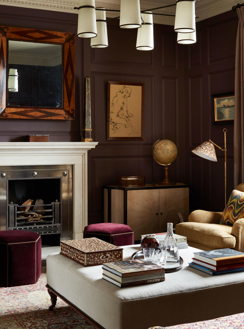 Brown living room with white painted fireplace and cozy furniture