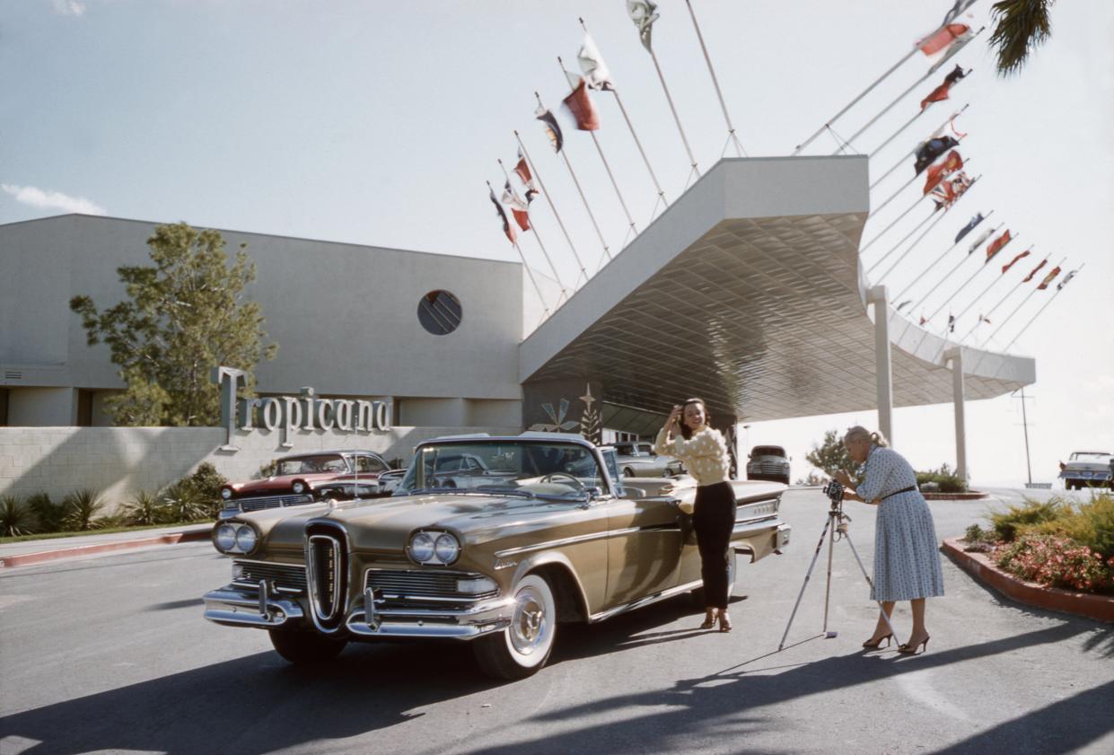 Kitty Dolan posing with car in front of the Tropicana