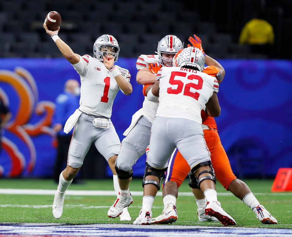 Ohio State Buckeyes quarterback Justin Fields (1) throws the ball against Clemson Tigers in the third quarter during the College Football Playoff semifinal at the Allstate Sugar Bowl in the Mercedes-Benz Superdome in New Orleans on Friday, Jan. 1, 2021.