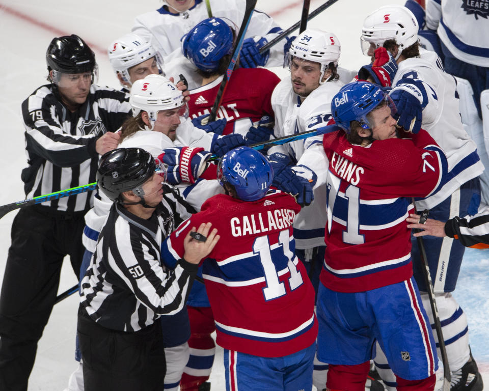 Montreal Canadiens and Toronto Maple Leafs players mix it up after the whistle during the second period of Game 6 of an NHL hockey Stanley Cup first-round playoff seres Saturday, May 29, 2021, in Montreal. (Ryan Remiorz/The Canadian Press via AP