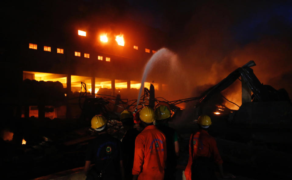 Firefighters work to put out a fire