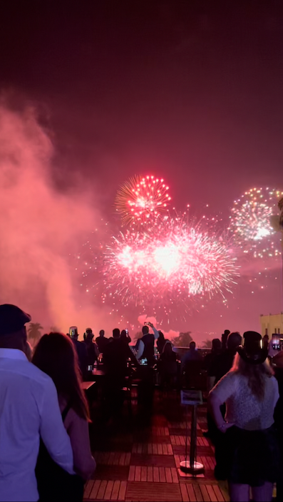 Partiers watch the downtown Fort Myers fireworks from the rooftop of Sidney & Berne Davis Art Center.