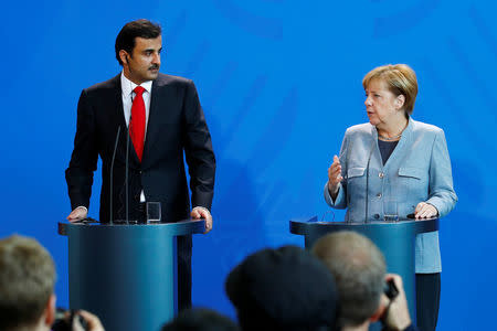 German Chancellor Angela Merkel and Qatar Emir Sheikh Tamim bin Hamad al-Thani attend a news conference in Berlin, Germany, September 15, 2017. REUTERS/Axel Schmidt