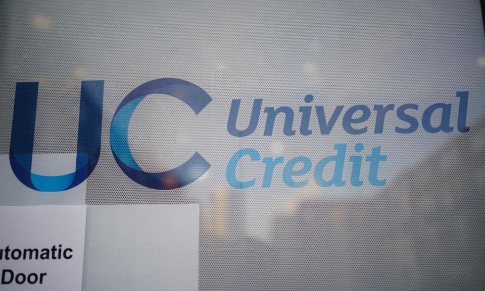 A universal credit sign on a door of a job centre plus