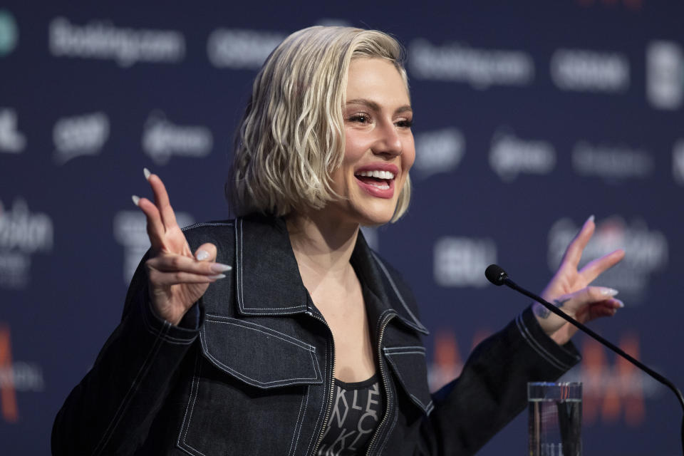 In this photo taken on May 12, 2021 Cyprus' performer Elena Tsagrinou gestures during an interview after rehearsing her song El Diablo at the Eurovision Song Contest at Ahoy arena in Rotterdam, Netherlands. Tsagrinou has already been in the spotlight after Orthodox Christian faithful on the Mediterranean island protested that it promoted satanic worship. Tsagrinou says her song El Diabolo, which she performs flanked by four dancers in skin-tight red costumes, was misinterpreted and is actually about an abusive relationship between two lovers. (AP Photo/Peter Dejong)