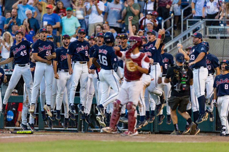 Mississippi's TJ McCants (16) celebrates after his two-run home run in the eighth inning against Oklahoma during Game 1 of the College World Series finals on Saturday night in Omaha, Neb.