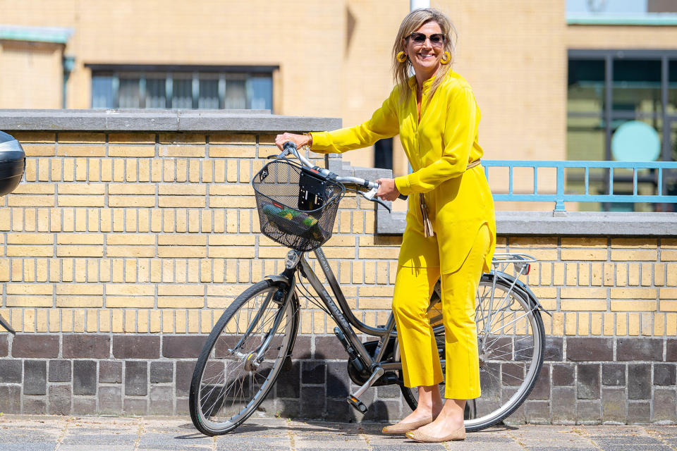 <p>Queen Maxima of the Netherlands dons a bright yellow jumpsuit as she visits The Hague on Tuesday. </p>