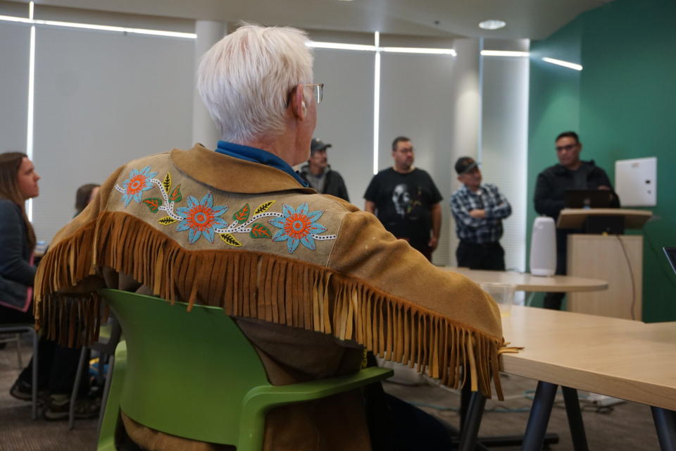 Andy Bassich of Eagle listens on Feb. 27 to a presentation by residents of Canada's Northwest Territories who are part of the Beavers and Socio-ecological Resilience in Inuit Nunangat project, also known as BARIN. Bassich and the Canadian visitors were at the University of Alaska Fairbanks attending a workshop of the Arctic Beaver Observation Network. (Photo by Yereth Rosen/Alaska Beacon)