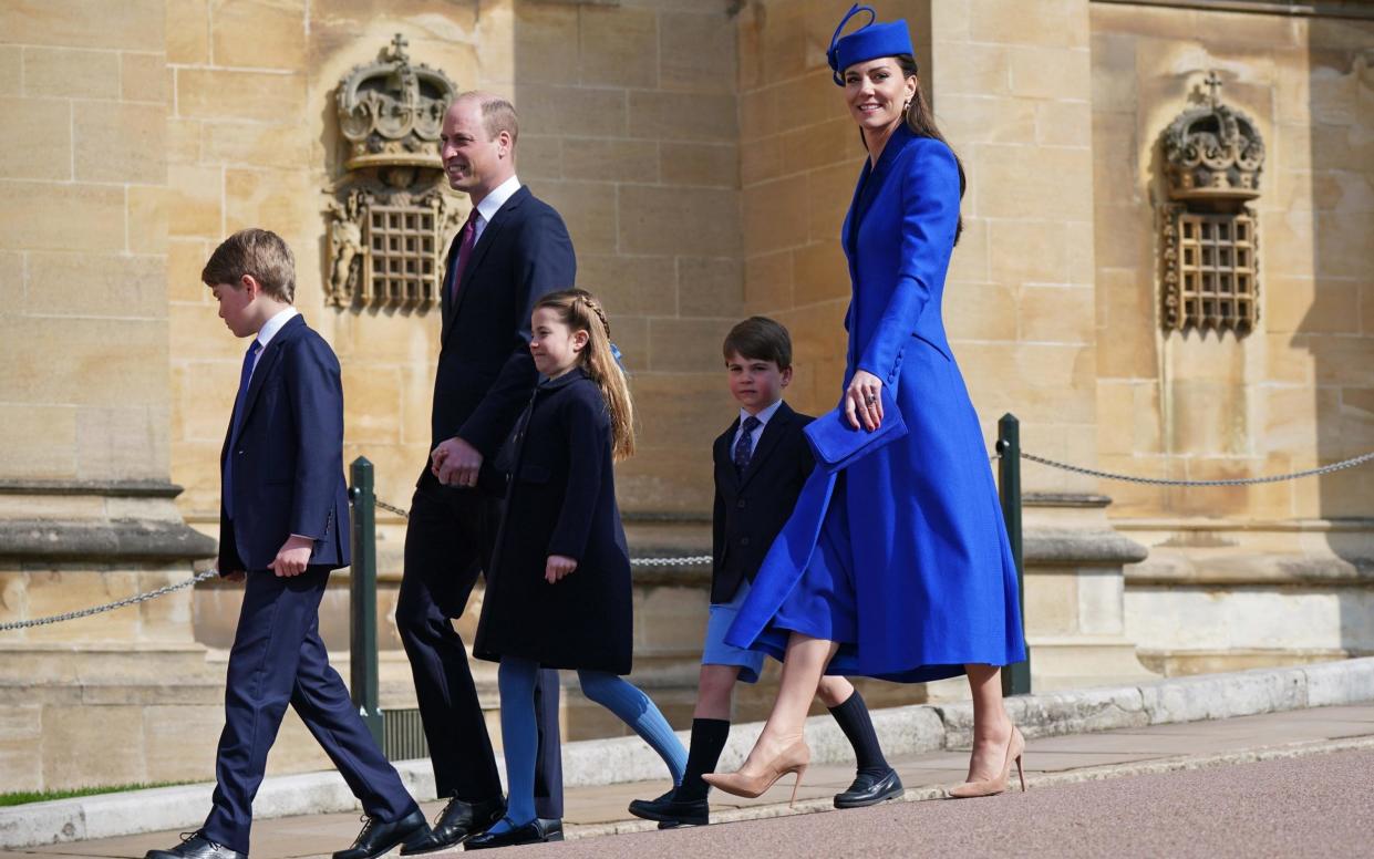 The Prince and Princess of Wales arrive for the Easter Sunday service at St George's chapel with Prince George, Princess Charlotte and Prince Louis. - Getty