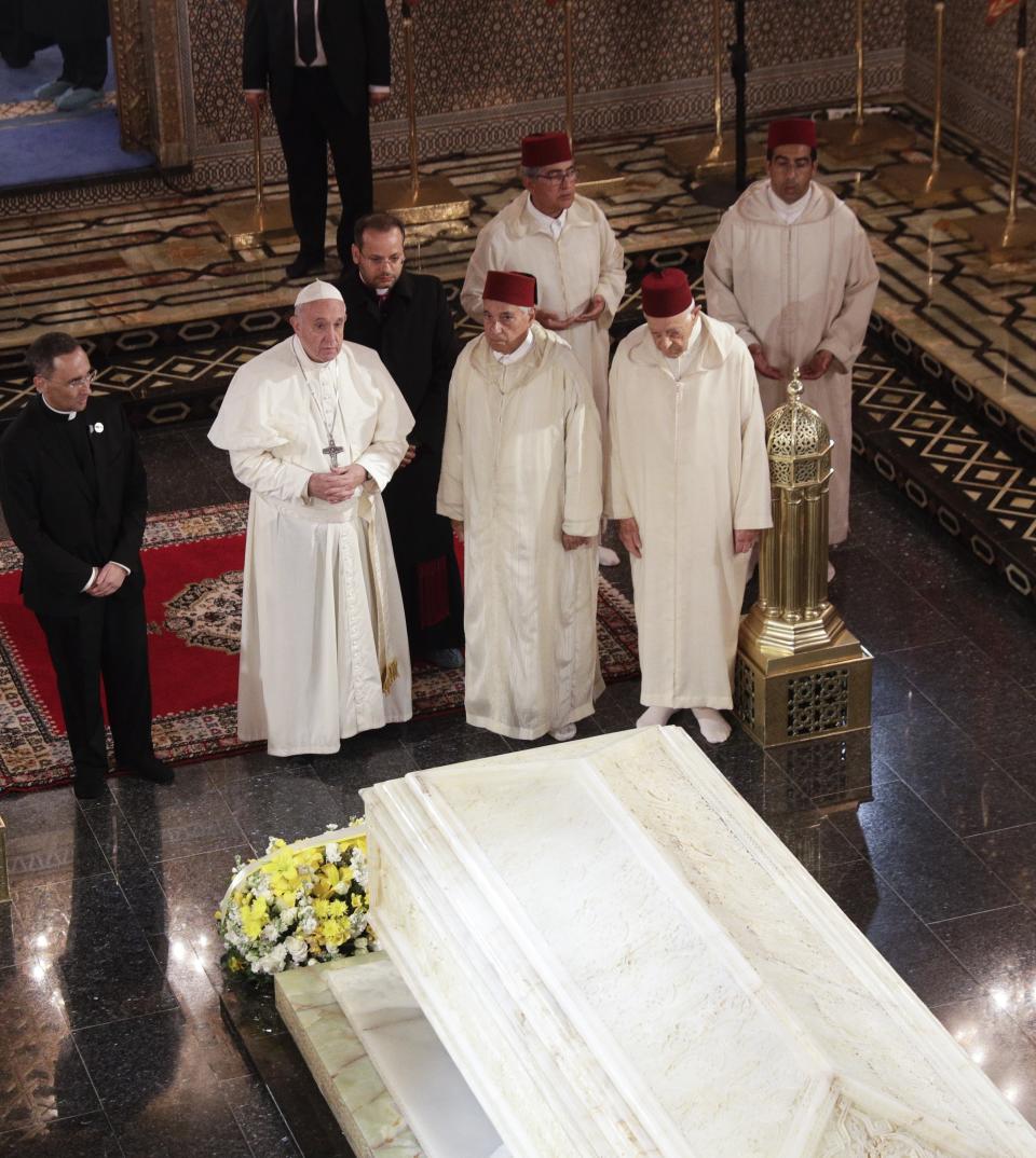 Pope Francis pays a visit to the Mausoleum of King Mohammed V, in Rabat, Morocco, Saturday, March 30, 2019. Francis's weekend trip to Morocco aims to highlight the North African nation's tradition of Christian-Muslim ties while also letting him show solidarity with migrants at Europe's door and tend to a tiny Catholic flock on the peripheries. (AP Photo/Gregorio Borgia)