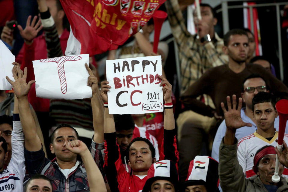 FILE - In this Nov. 19, 2013 file photo, an Egyptian soccer fan holds a banner congratulating Egyptian Defense Minister Gen. Abdel-Fattah el-Sissi during the second leg of the World Cup qualifying playoff at the Air Defense Stadium in Cairo. Egypt's military chief is looking for a strong turnout in next week's nationwide constitutional referendum as a mandate on whether he should run for president, senior officials tell the AP. The popular general who ousted President Mohammed Morsi and ordered a crackdown on the Muslim Brotherhood could be disappointed as his Islamist foes have promised a boycott and mass demonstrations raising fears of violence that are likely to keep voters at home.(AP Photo/Manu Brabo, File)