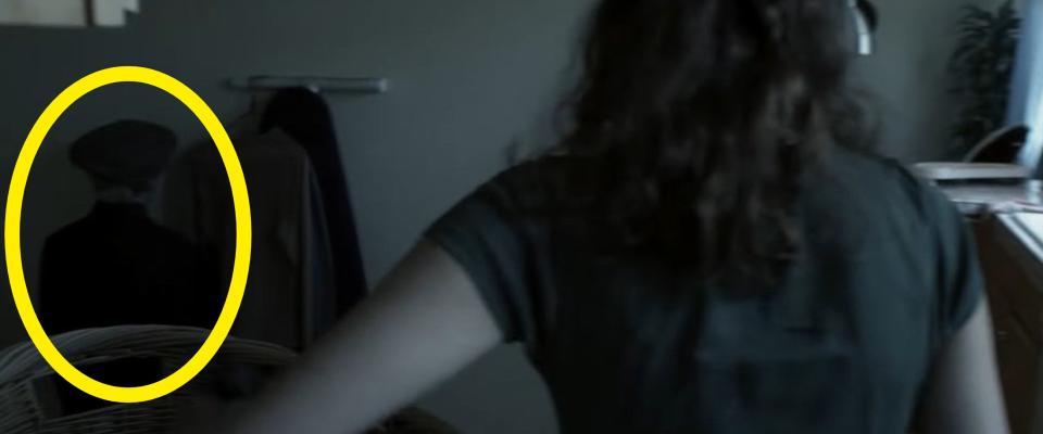 Renai putting laundry into a basket in "Insidious"