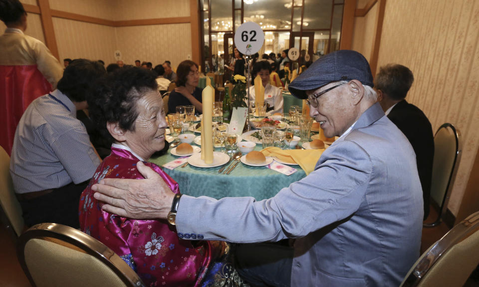South Korean Lee Yong-seong, 95, right, meets with his North Korean niece Ri Sun Seon, 62, at a dinner during the Separated Family Reunion Meeting at the Diamond Mountain resort in North Korea, Monday, Aug. 20, 2018. Dozens of elderly South Koreans crossed the heavily fortified border into North Korea on Monday for heart-wrenching meetings with relatives most haven't seen since they were separated by the turmoil of the Korean War, some 65 years ago. (Korea Pool Photo via AP)